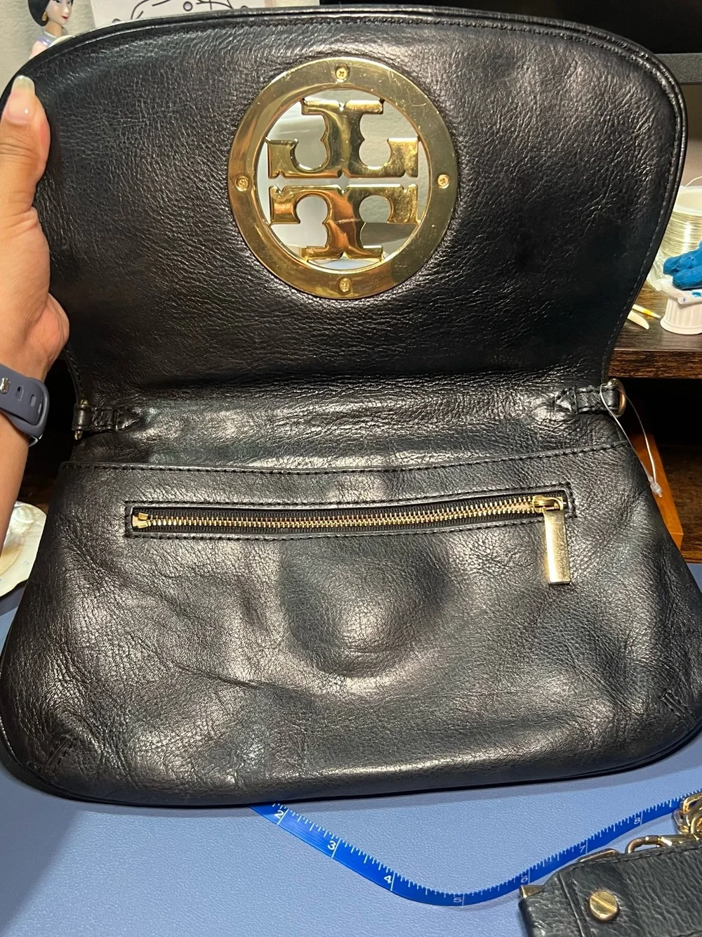 Pre-loved Tory Burch Black Leather clutch with Gold hardware